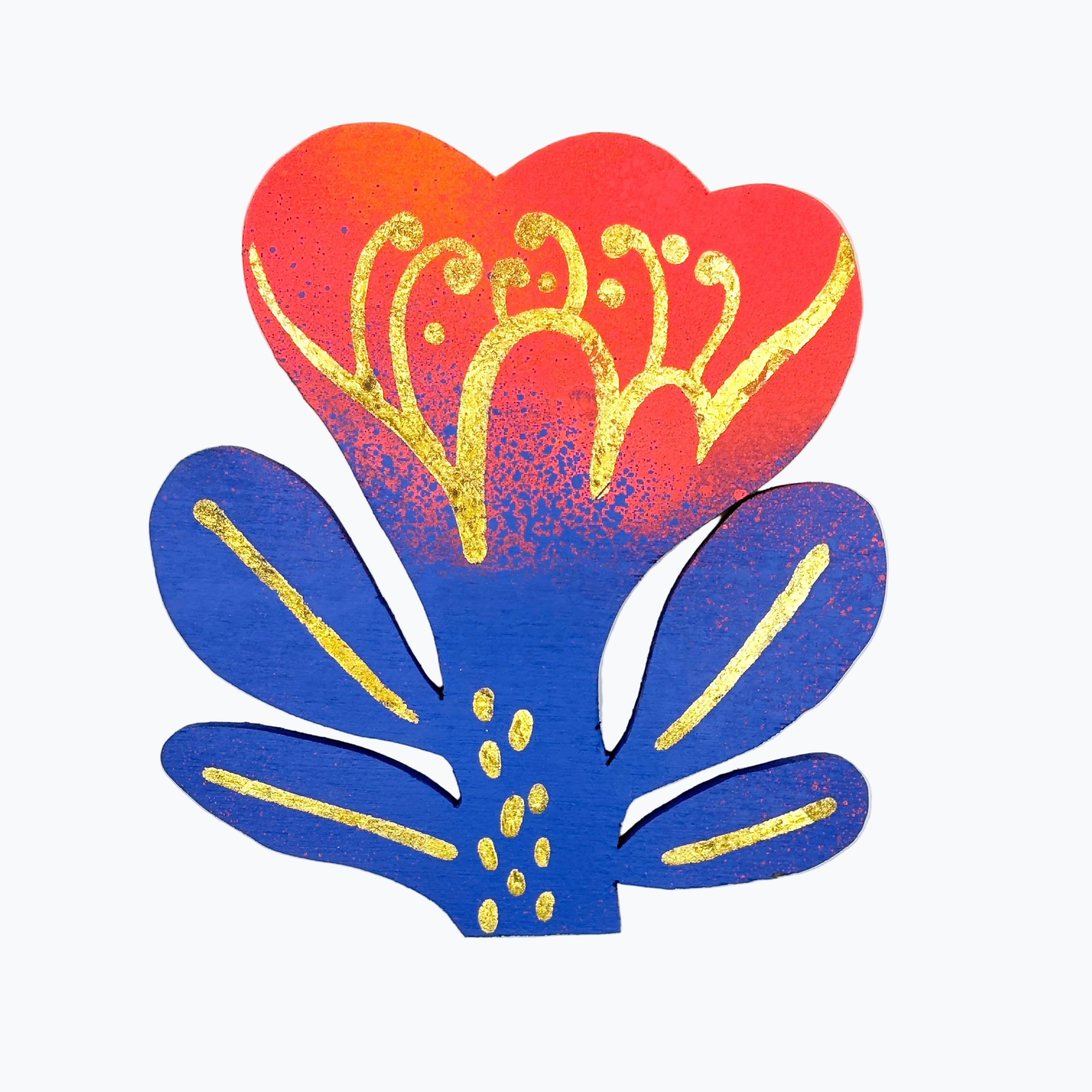 Decorative flower shape object with red, blue, and gold design on a white background